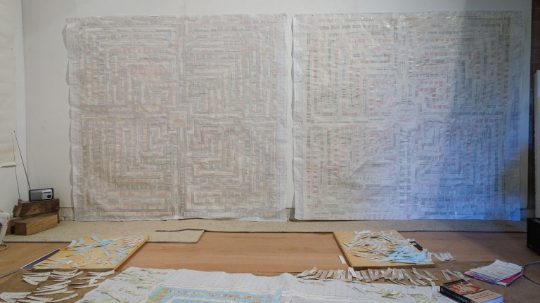 Artists studio shot showing The 48 Laws of Power: 1-25 - wall size collage made of Robert Greene's bestselling book - artwork by Michelle Rumney
