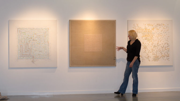 Artist Michelle Rumney talking about her work at an exhibition in Lighthouse in Poole