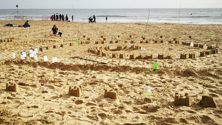Sandcastles of the Plastic Pathways Beach labyrinth on the sand for Arts by the Sea festival by artist Michelle Rumney