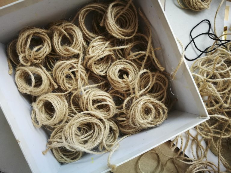 Curls of Measured to the Saint lengths of string by artist Michelle Rumney