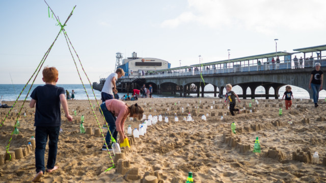 Walking the Plastic Pathways Beach labyrinth on the sand for Arts by the Sea festival by artist Michelle Rumney