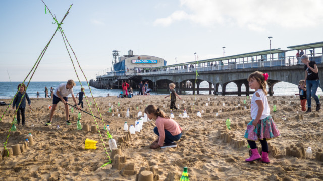 Walking the Plastic Pathways Beach labyrinth on the sand for Arts by the Sea festival by artist Michelle Rumney