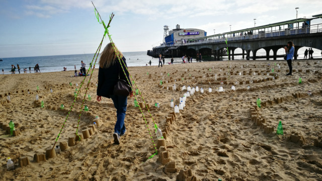 Walking the Plastic Pathways Beach labyrinth on the sand for Arts by the Sea festival by artist Michelle Rumney