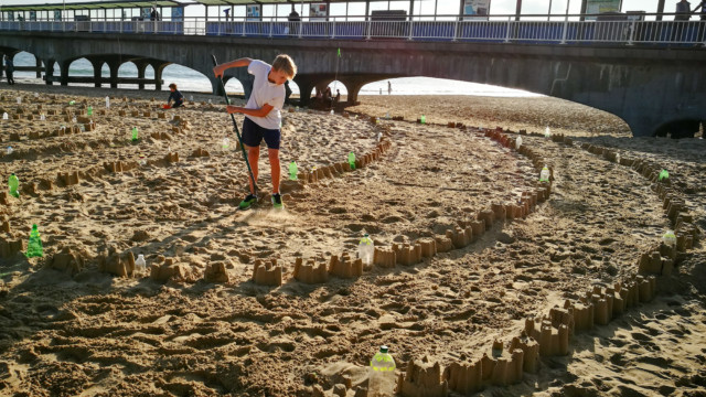 View from the pier of the Plastic Pathways Beach labyrinth on the sand for Arts by the Sea festival by artist Michelle Rumney