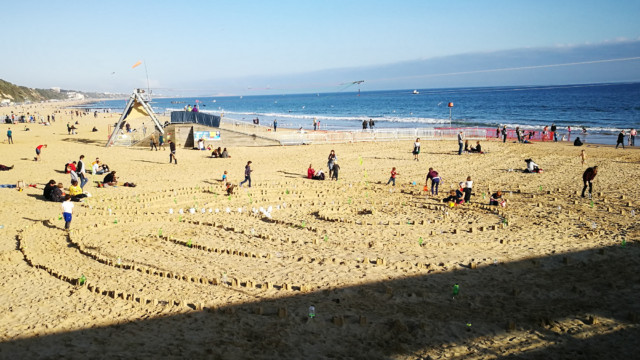 View from the pier of the Plastic Pathways Beach labyrinth on the sand for Arts by the Sea festival by artist Michelle Rumney