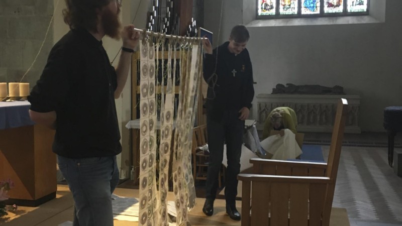 artwork ready to be installed hanging from the bell tower of St Marys Priory Church Abergavenny in Wales - part of the St Thomas Way